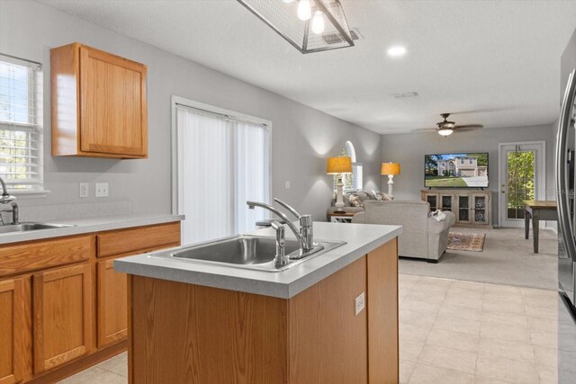 2541 W Castle Rd, Citrus Springs, FL 34434 - kitchen featuring a sink, a ceiling fan, open floor plan, and light countertops