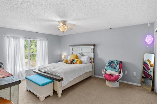 2541 W Castle Rd, Citrus Springs, FL 34434 - carpeted bedroom featuring a textured ceiling, ceiling fan, and baseboards