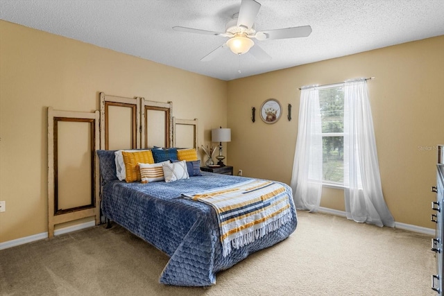 2541 W Castle Rd, Citrus Springs, FL 34434 - bedroom with light colored carpet, a textured ceiling, baseboards, and a ceiling fan