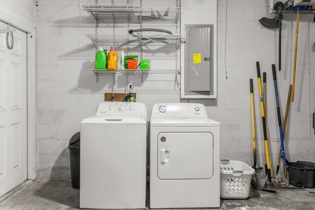 2541 W Castle Rd, Citrus Springs, FL 34434 - laundry area with separate washer and dryer, electric panel, and concrete block wall