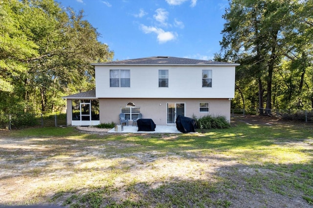 2541 W Castle Rd, Citrus Springs, FL 34434 - back of house featuring a patio area and a sunroom