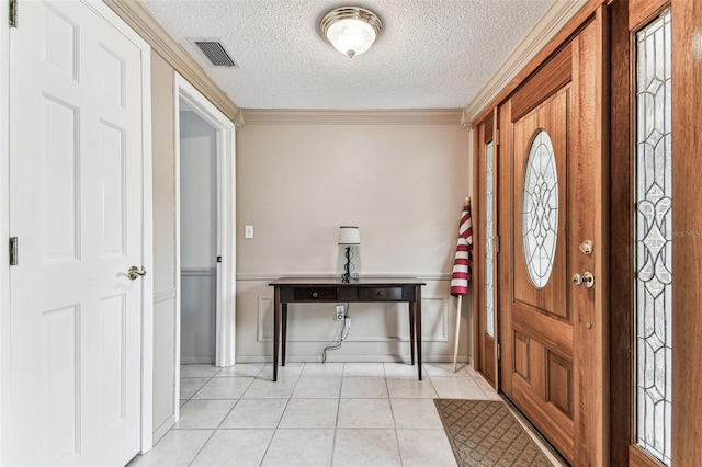 12101 Meadowbrook Ln, Hudson, FL 34667 - foyer featuring a textured ceiling and light tile patterned floors