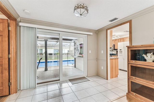12101 Meadowbrook Ln, Hudson, FL 34667 - entryway featuring ornamental molding and light tile patterned floors