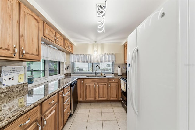 12101 Meadowbrook Ln, Hudson, FL 34667 - kitchen with a sink, stainless steel appliances, backsplash, and brown cabinets