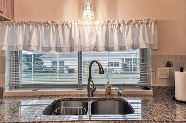 12101 Meadowbrook Ln, Hudson, FL 34667 - detailed view of a sink, backsplash, and stone countertops