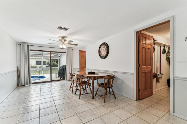 12101 Meadowbrook Ln, Hudson, FL 34667 - dining space featuring a ceiling fan and light tile patterned flooring