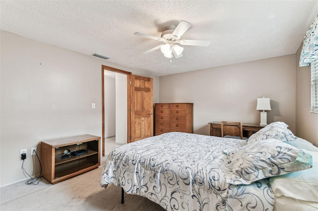 12101 Meadowbrook Ln, Hudson, FL 34667 - carpeted bedroom with a textured ceiling and ceiling fan