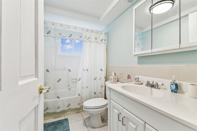 12101 Meadowbrook Ln, Hudson, FL 34667 - full bath featuring vanity, toilet, shower / bath combo with shower curtain, tile patterned flooring, and tile walls