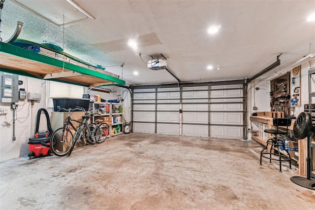 12101 Meadowbrook Ln, Hudson, FL 34667 - garage featuring a garage door opener and recessed lighting