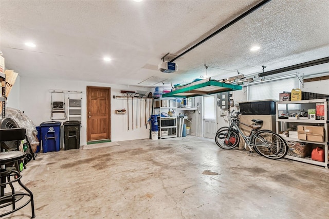 12101 Meadowbrook Ln, Hudson, FL 34667 - garage featuring a garage door opener and recessed lighting