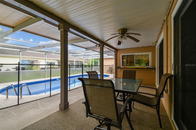 12101 Meadowbrook Ln, Hudson, FL 34667 - sunroom with ceiling fan, a pool, and plenty of natural light
