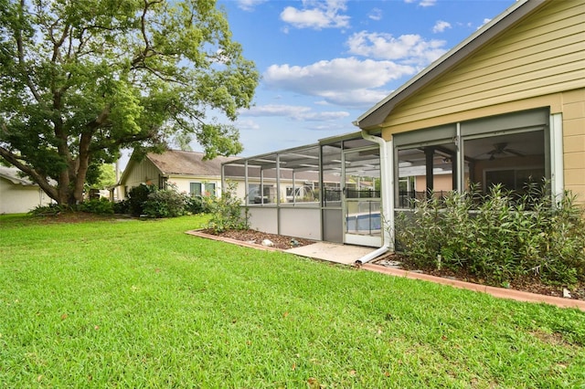 12101 Meadowbrook Ln, Hudson, FL 34667 - view of grassy yard featuring glass enclosure