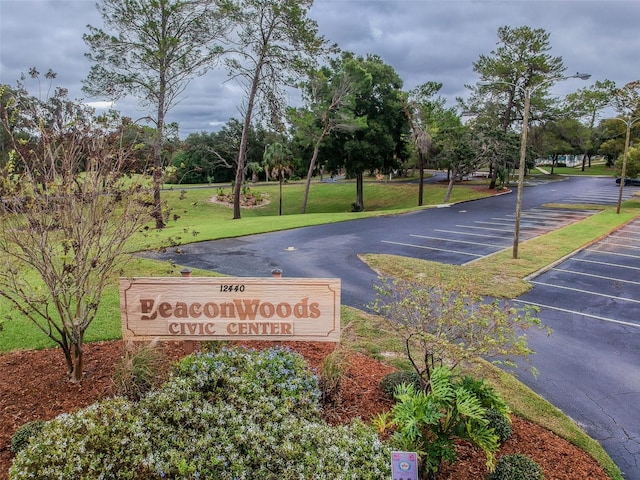 12101 Meadowbrook Ln, Hudson, FL 34667 - community / neighborhood sign with uncovered parking and a yard