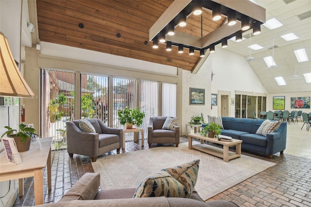 12101 Meadowbrook Ln, Hudson, FL 34667 - living room featuring high vaulted ceiling, brick floors, and wooden ceiling