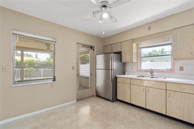 13898 Jamaica Dr, Seminole, FL 33776 - kitchen featuring freestanding refrigerator, light brown cabinetry, a ceiling fan, and decorative backsplash