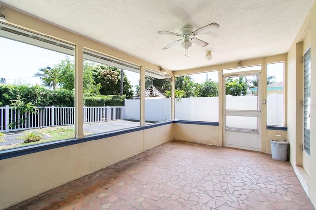 13898 Jamaica Dr, Seminole, FL 33776 - unfurnished sunroom with a ceiling fan and plenty of natural light