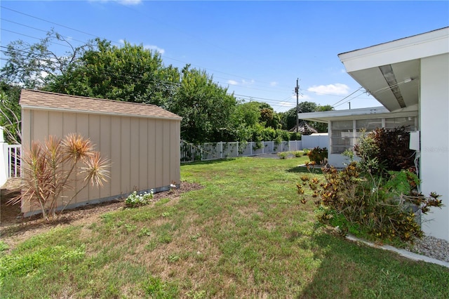 13898 Jamaica Dr, Seminole, FL 33776 - view of yard with a storage unit