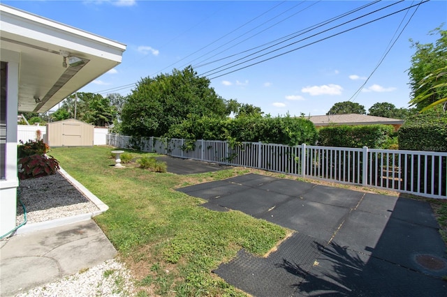13898 Jamaica Dr, Seminole, FL 33776 - fenced backyard featuring a shed and a patio