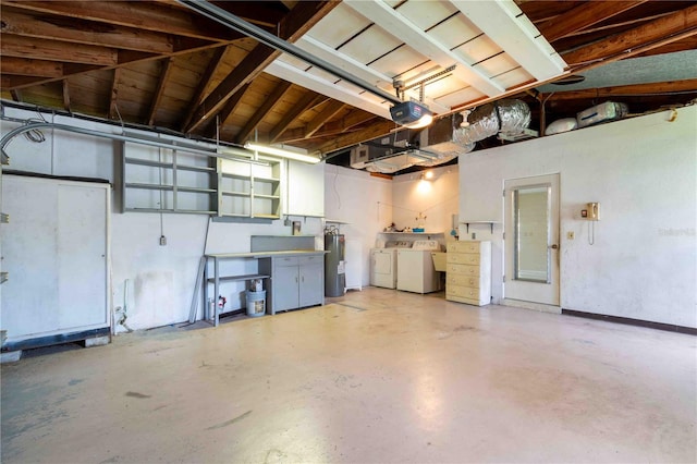 13898 Jamaica Dr, Seminole, FL 33776 - garage featuring washer and clothes dryer, water heater, and a garage door opener