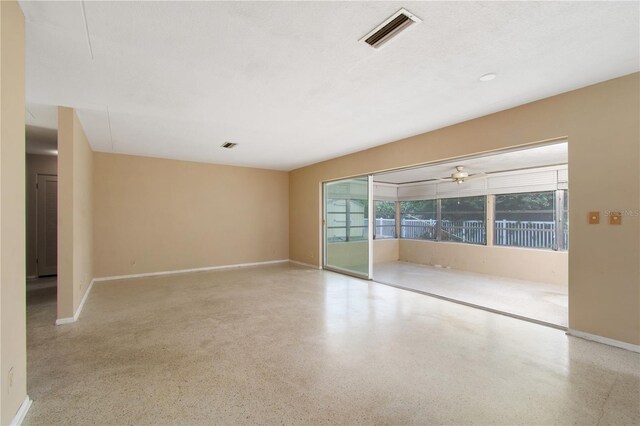 13898 Jamaica Dr, Seminole, FL 33776 - empty room with speckled floor