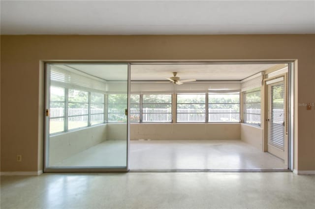 13898 Jamaica Dr, Seminole, FL 33776 - unfurnished sunroom with baseboards