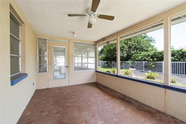 13898 Jamaica Dr, Seminole, FL 33776 - unfurnished sunroom featuring a ceiling fan