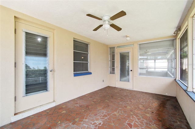 13898 Jamaica Dr, Seminole, FL 33776 - unfurnished sunroom featuring a ceiling fan