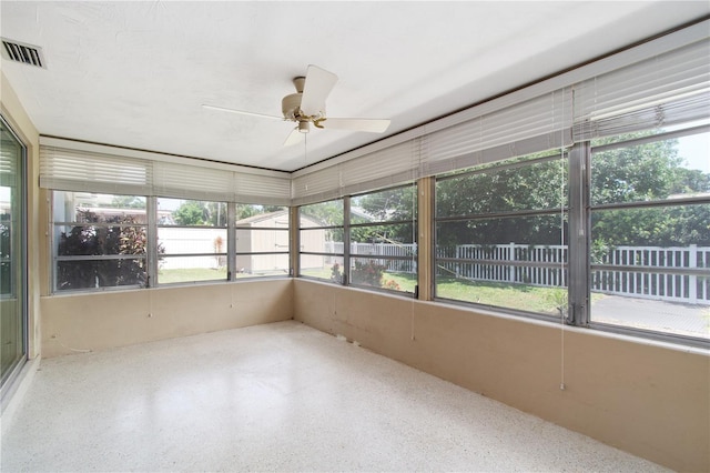 13898 Jamaica Dr, Seminole, FL 33776 - unfurnished sunroom with plenty of natural light and ceiling fan
