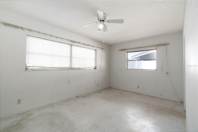 13898 Jamaica Dr, Seminole, FL 33776 - spare room with speckled floor and ceiling fan