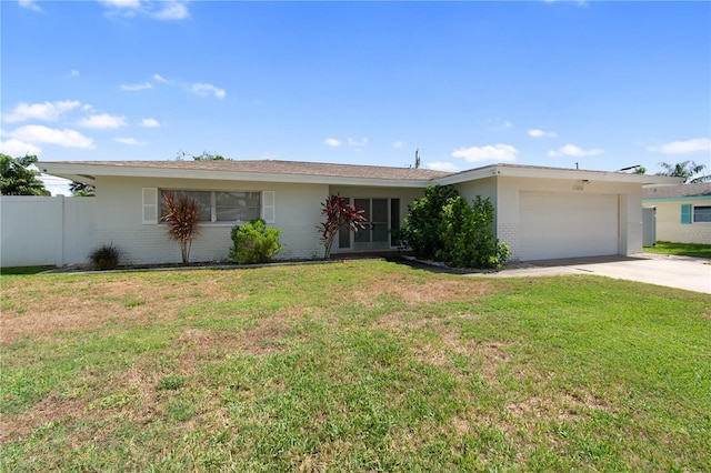 13898 Jamaica Dr, Seminole, FL 33776 - ranch-style home with a garage, concrete driveway, brick siding, and stucco siding