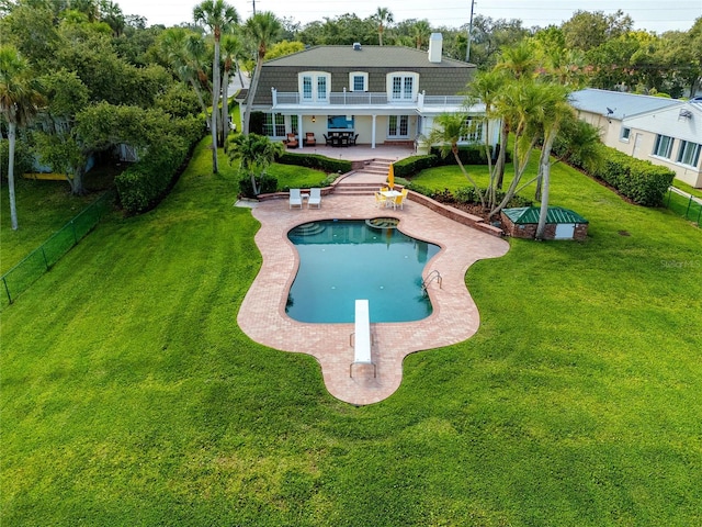 224 Harbor View Ln, Largo, FL 33770 - swimming pool with a patio area, french doors, a diving board, and a fenced backyard