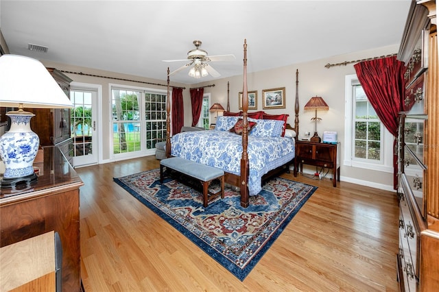 224 Harbor View Ln, Largo, FL 33770 - bedroom with wood finished floors, access to outside, and ceiling fan