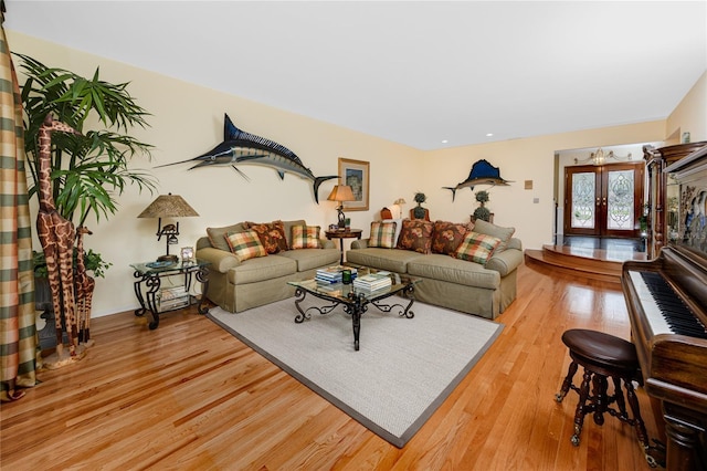 224 Harbor View Ln, Largo, FL 33770 - living area with light wood-style flooring and french doors