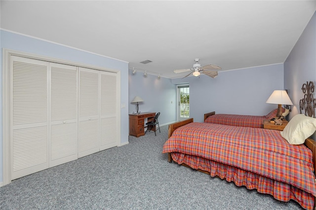 224 Harbor View Ln, Largo, FL 33770 - bedroom with a closet, carpet floors, ceiling fan, track lighting, and ornamental molding
