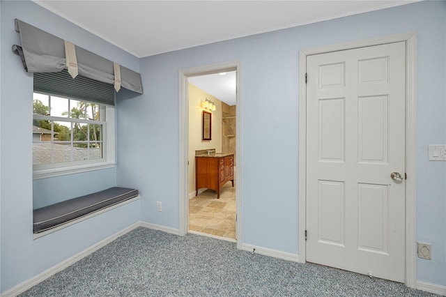 224 Harbor View Ln, Largo, FL 33770 - mudroom featuring baseboards and carpet flooring