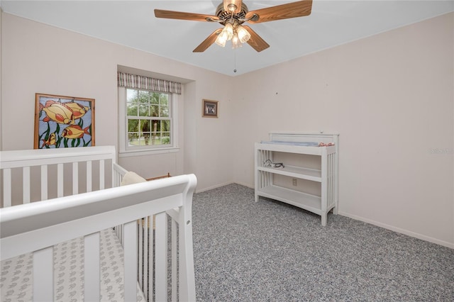 224 Harbor View Ln, Largo, FL 33770 - bedroom with carpet floors, a ceiling fan, and a nursery area