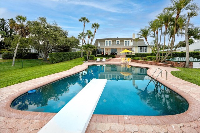 224 Harbor View Ln, Largo, FL 33770 - swimming pool with a diving board and a patio area