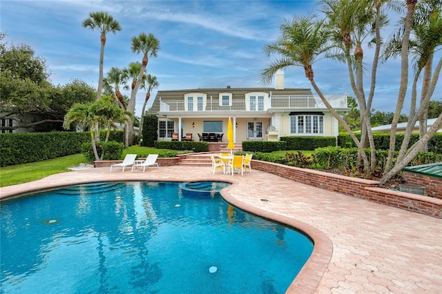 224 Harbor View Ln, Largo, FL 33770 - view of swimming pool with a patio area, a pool with connected hot tub, and french doors