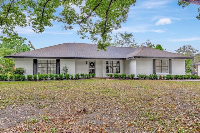9615 Raiden Ln, Riverview, FL 33569 - view of front facade featuring brick siding and a shingled roof