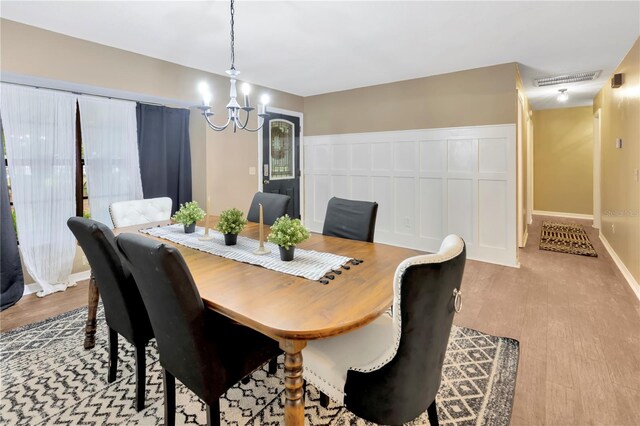 9615 Raiden Ln, Riverview, FL 33569 - dining space with a chandelier and wood finished floors