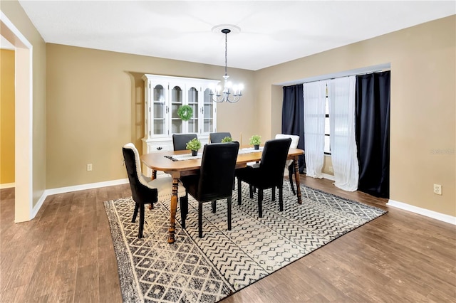 9615 Raiden Ln, Riverview, FL 33569 - dining room with a chandelier, wood finished floors, and baseboards