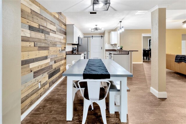9615 Raiden Ln, Riverview, FL 33569 - kitchen with wooden walls, dark countertops, appliances with stainless steel finishes, baseboards, and white cabinets
