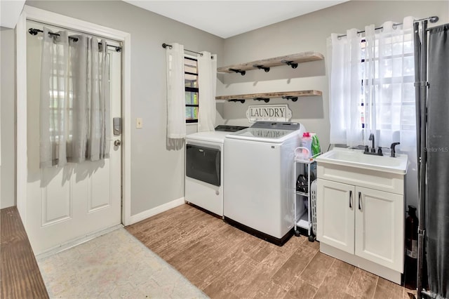9615 Raiden Ln, Riverview, FL 33569 - laundry area featuring washing machine and dryer and light wood finished floors