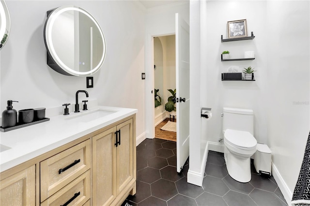 9615 Raiden Ln, Riverview, FL 33569 - bathroom with double vanity, tile patterned flooring, toilet, and baseboards