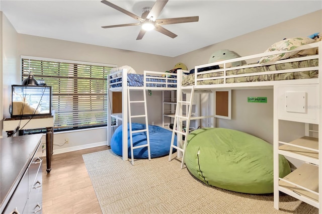 9615 Raiden Ln, Riverview, FL 33569 - bedroom with baseboards and wood finished floors