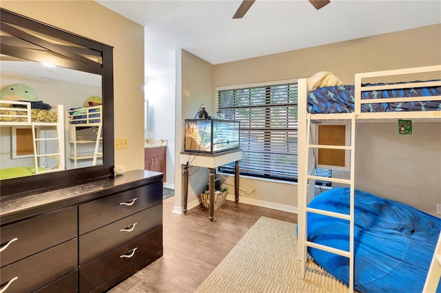 9615 Raiden Ln, Riverview, FL 33569 - bedroom with baseboards, wood finished floors, and ceiling fan