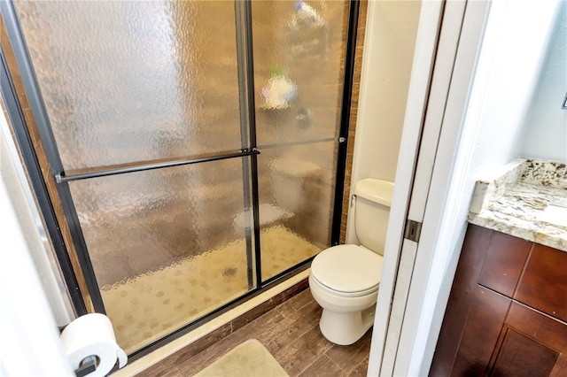 9615 Raiden Ln, Riverview, FL 33569 - full bathroom with toilet, a shower stall, and wood finished floors