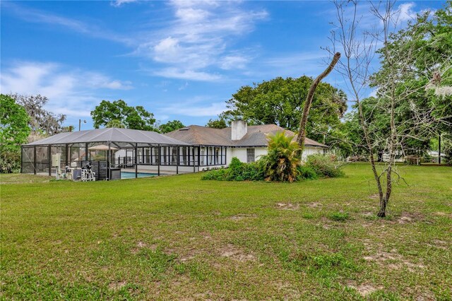 9615 Raiden Ln, Riverview, FL 33569 - view of grassy yard featuring glass enclosure