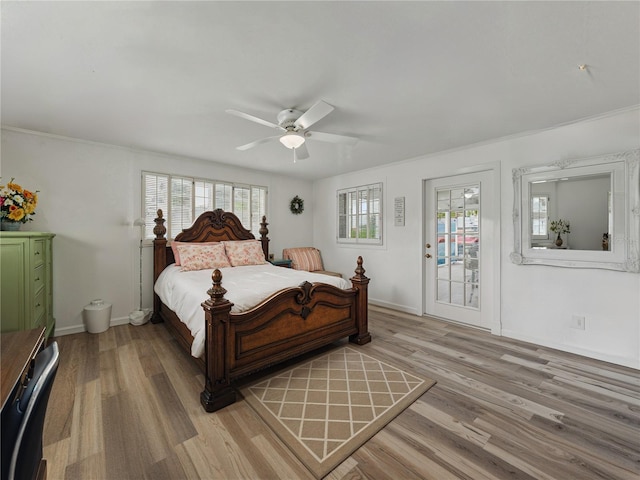 140 Morrow Cir, Brandon, FL 33510 - bedroom with multiple windows, light wood-style flooring, and access to exterior