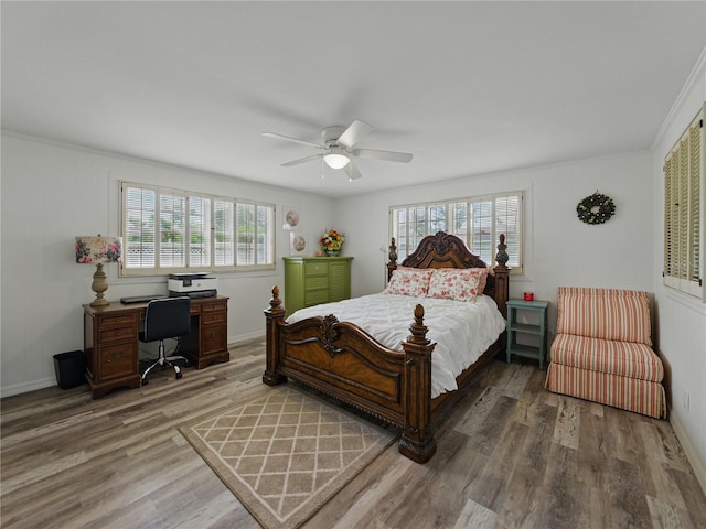140 Morrow Cir, Brandon, FL 33510 - bedroom featuring multiple windows, wood finished floors, a desk, ceiling fan, and crown molding